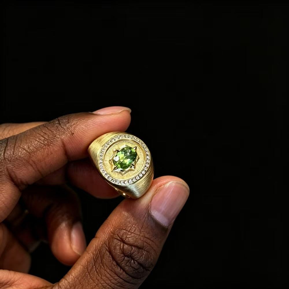 Solstice Signet Ring held in hand