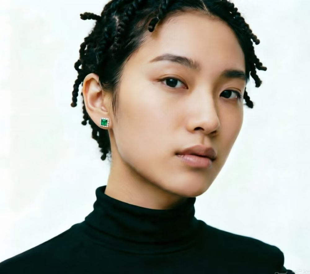 Emerald Halo Stud Earrings on model
